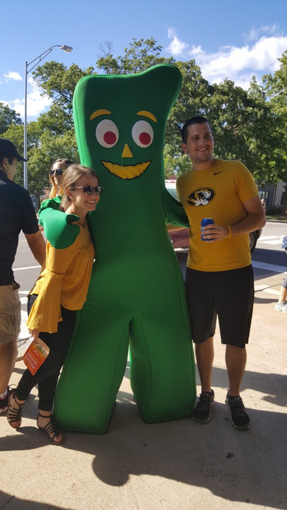 People posing with Gumby.