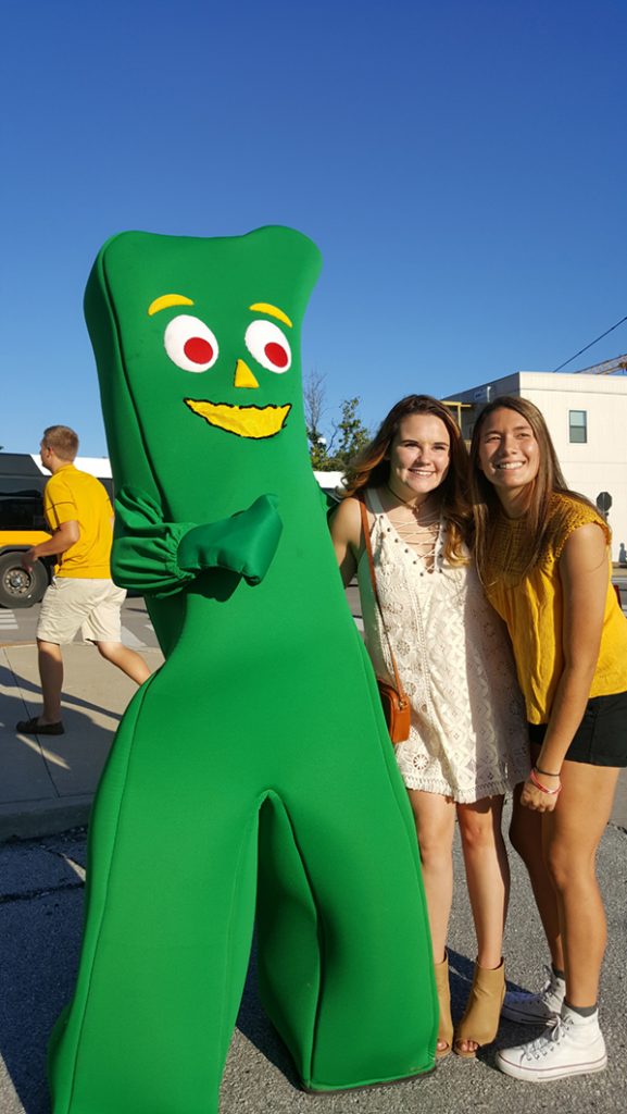 People posing with Gumby.