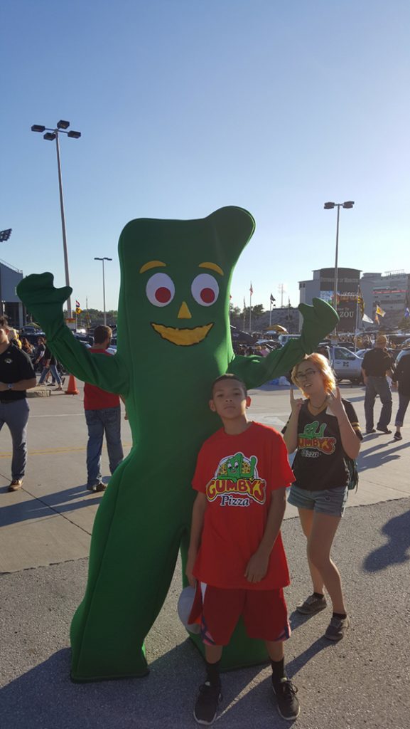 People posing with Gumby.