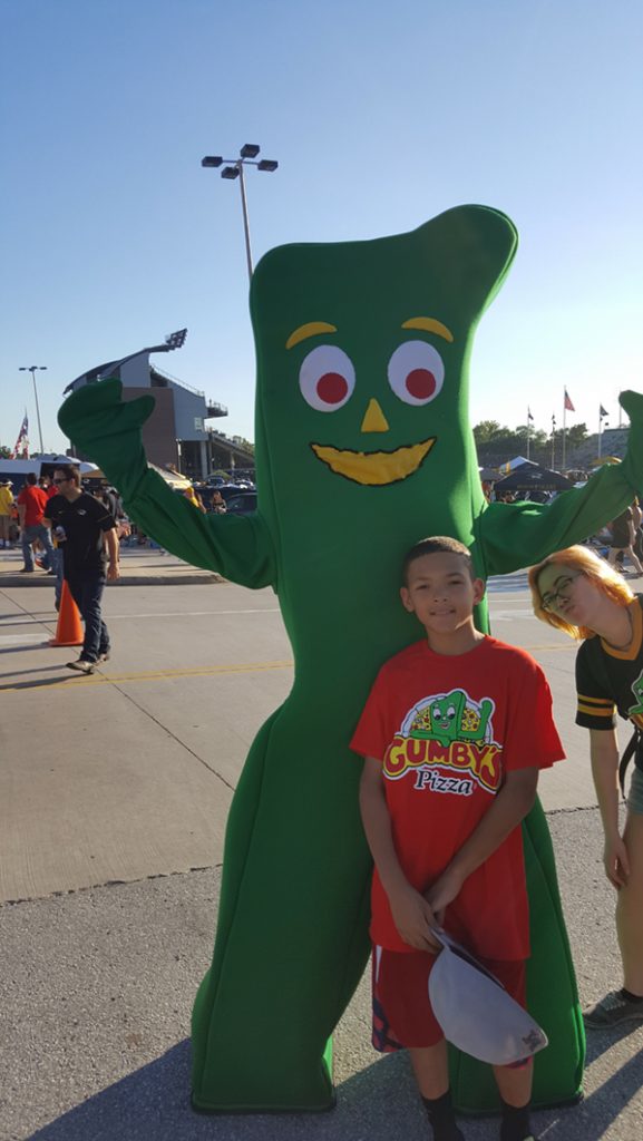 People posing with Gumby.