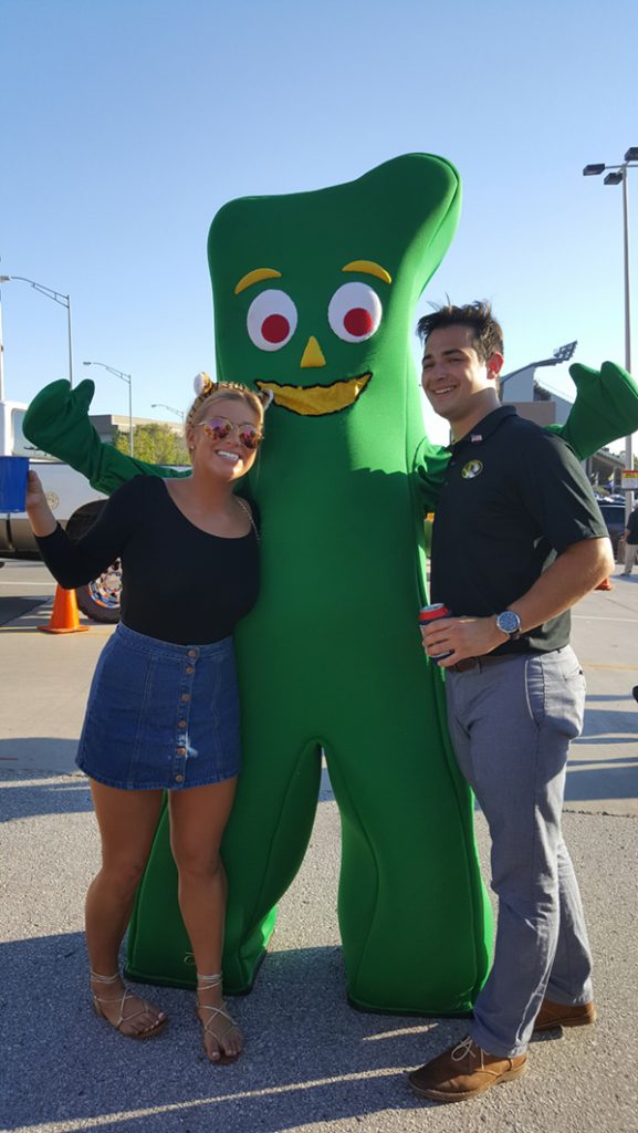 People posing with Gumby.