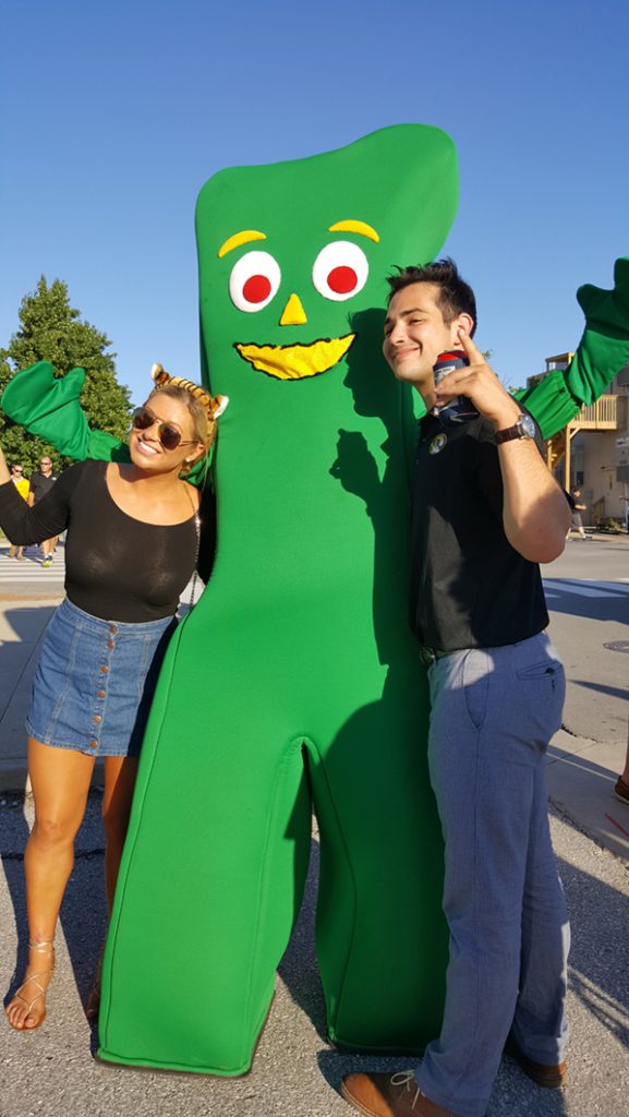 People posing with Gumby.