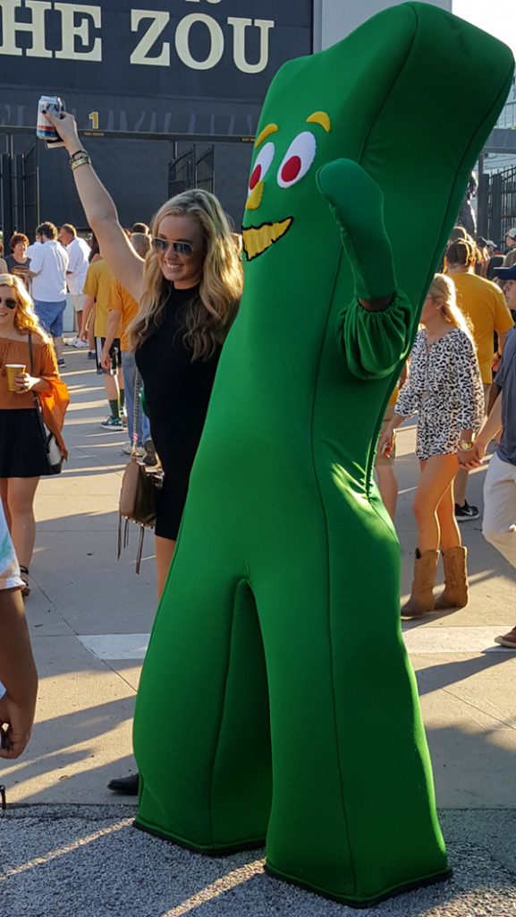 People posing with Gumby.