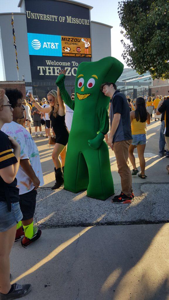 People posing with Gumby.