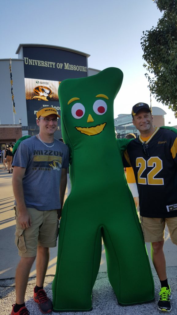 People posing with Gumby.