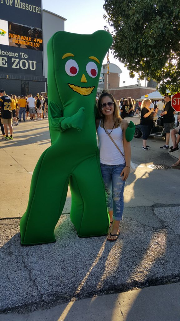 People posing with Gumby.