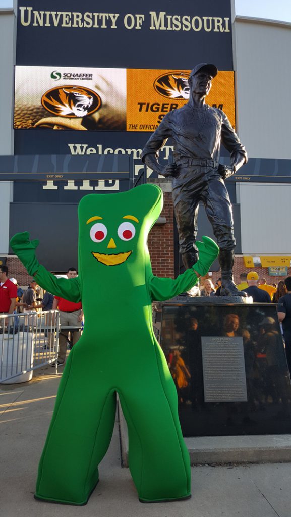 People posing with Gumby.