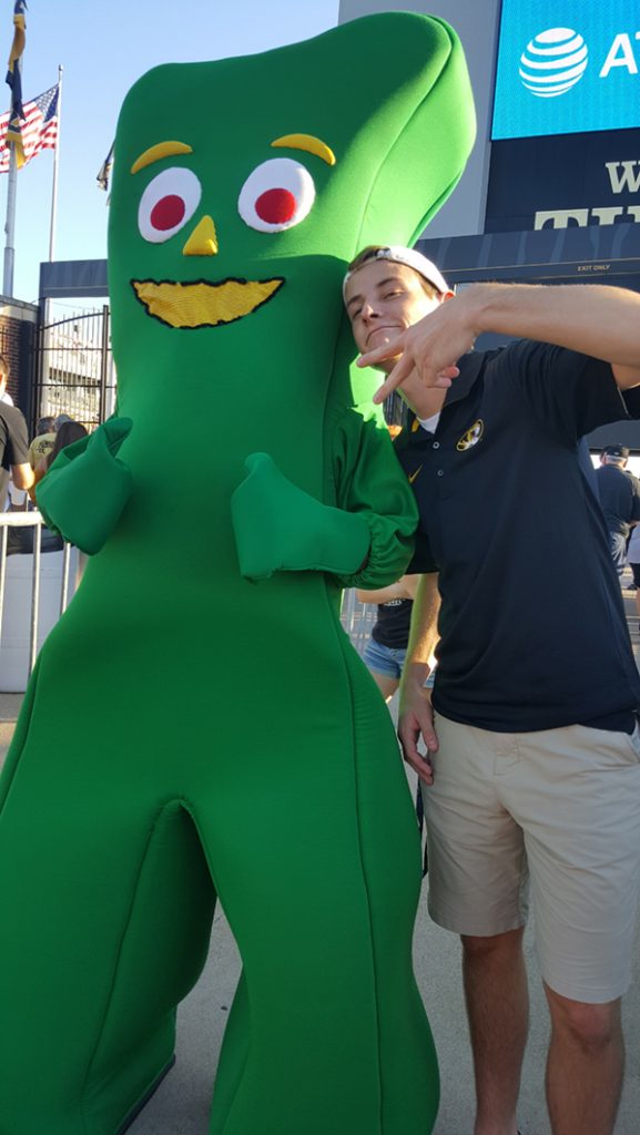 People posing with Gumby.