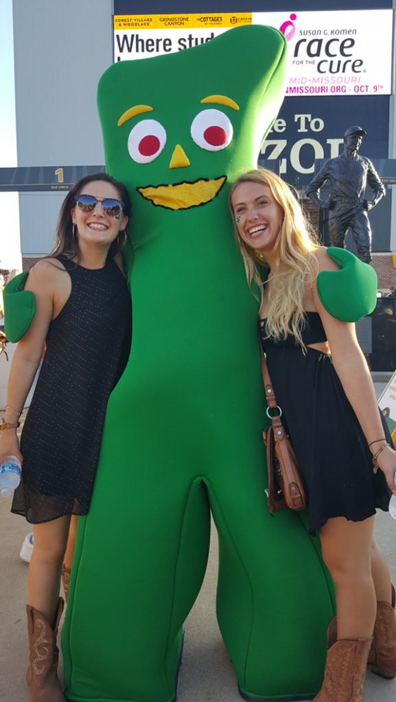 People posing with Gumby.