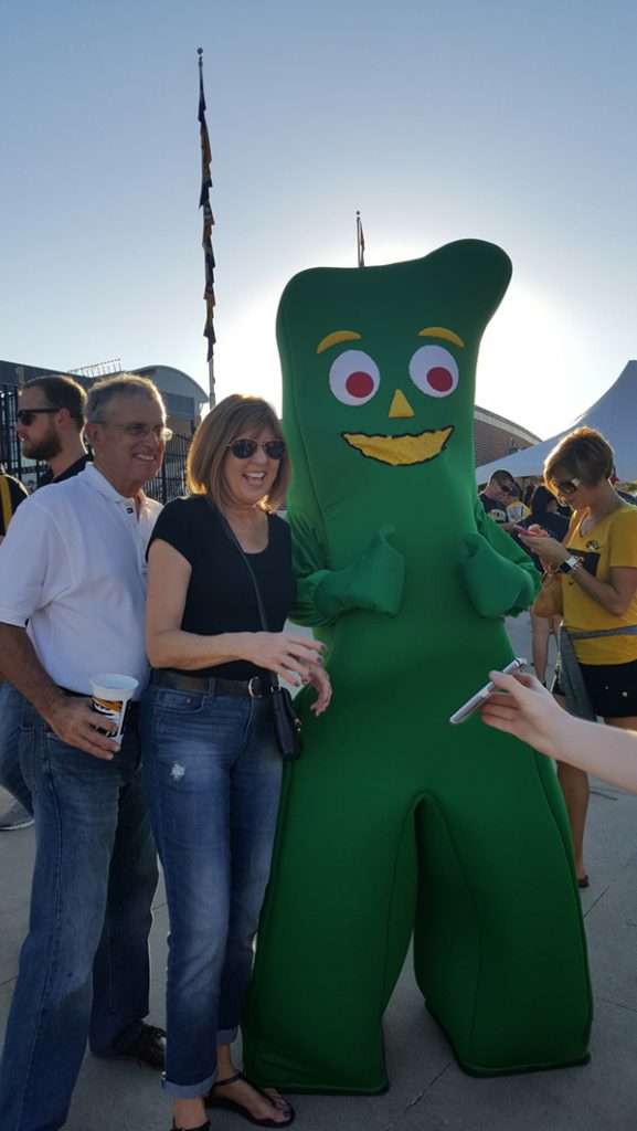 People posing with Gumby.