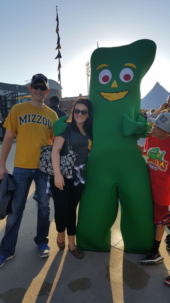 People posing with Gumby.