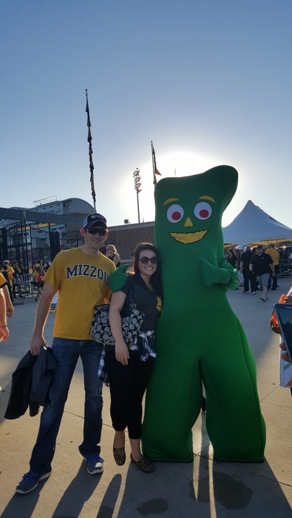 People posing with Gumby.