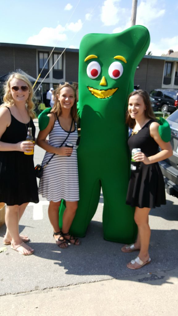 People posing with Gumby.