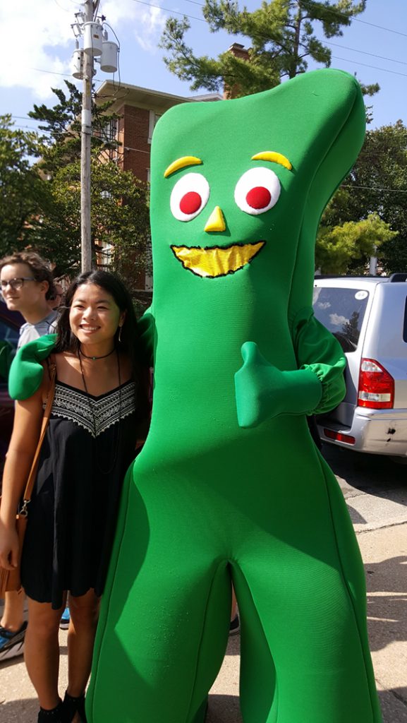 People posing with Gumby.