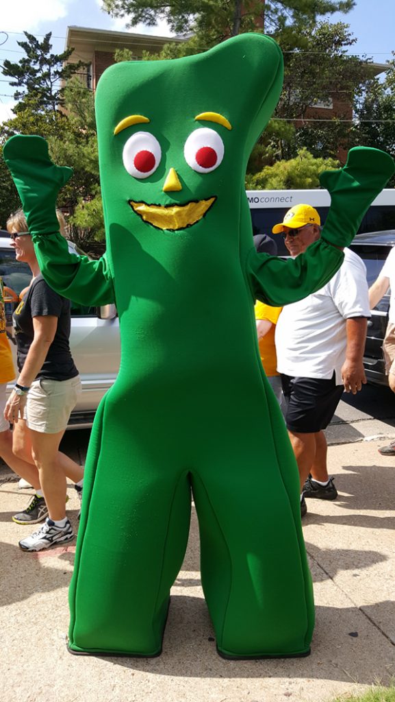 People posing with Gumby.