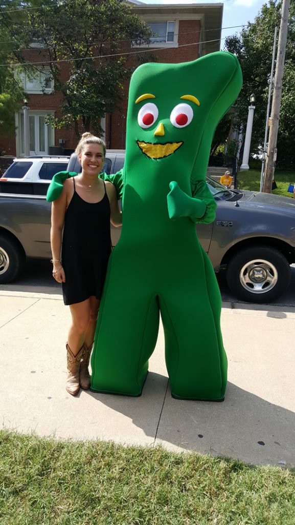 People posing with Gumby.