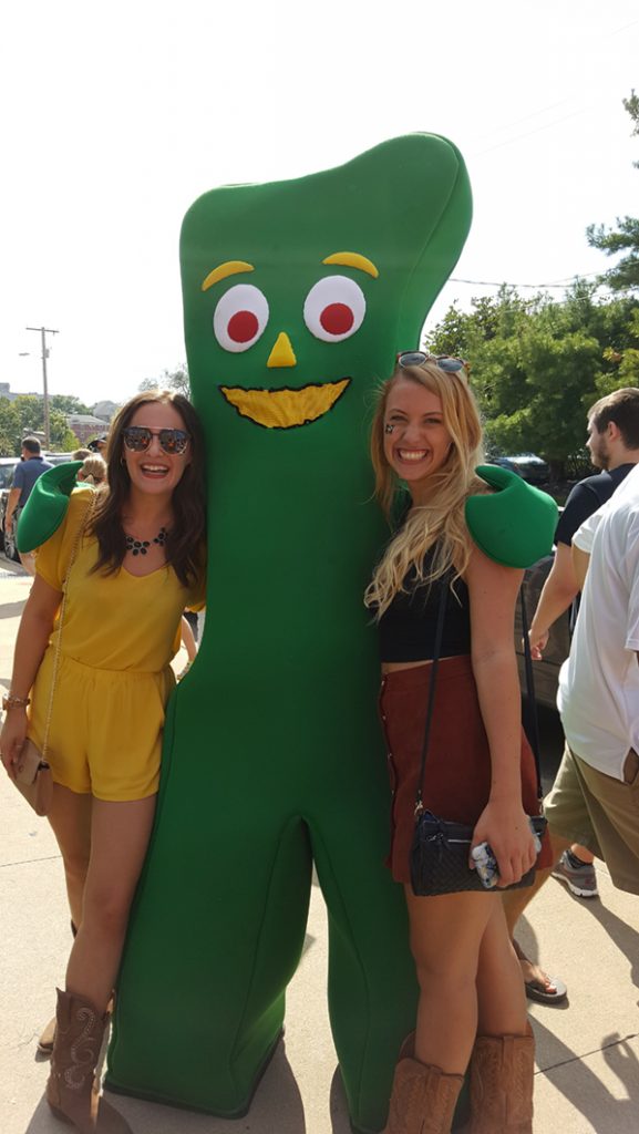 People posing with Gumby.