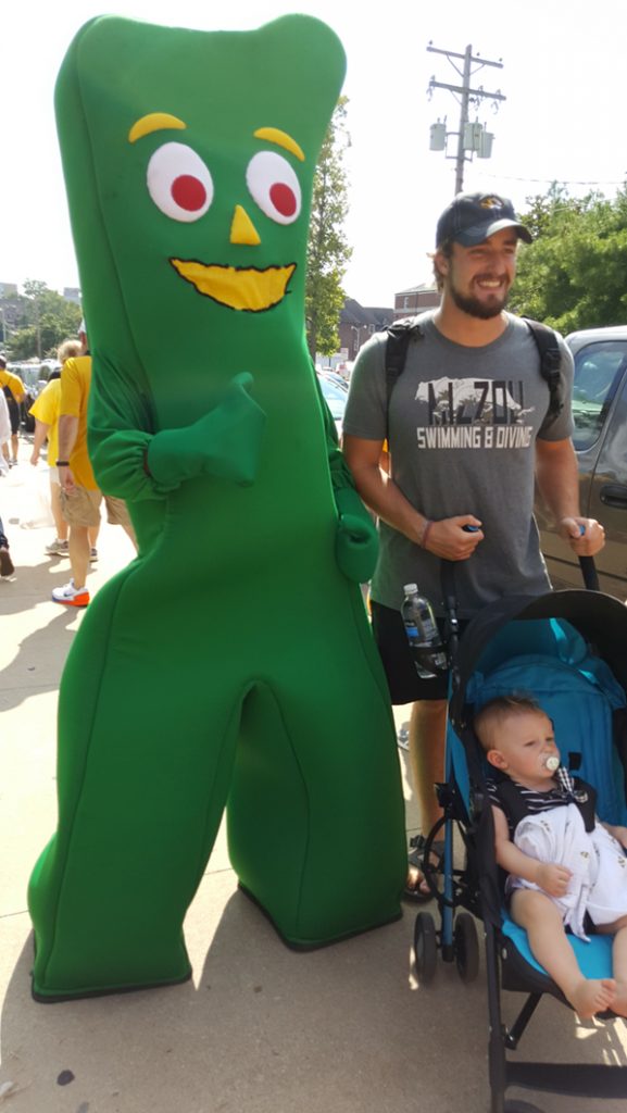 People posing with Gumby.