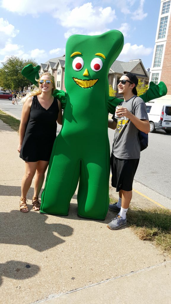 People posing with Gumby.