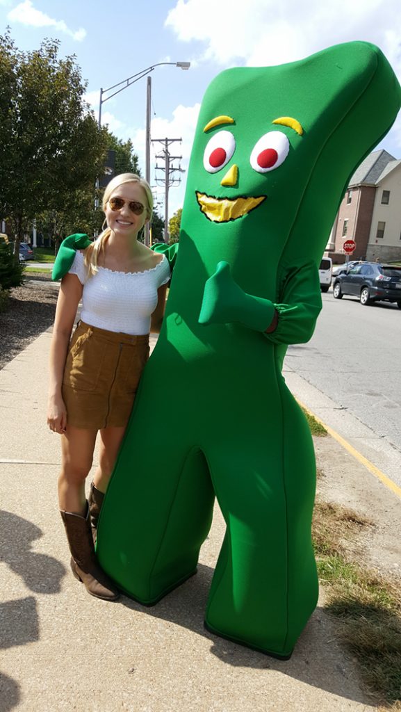 People posing with Gumby.