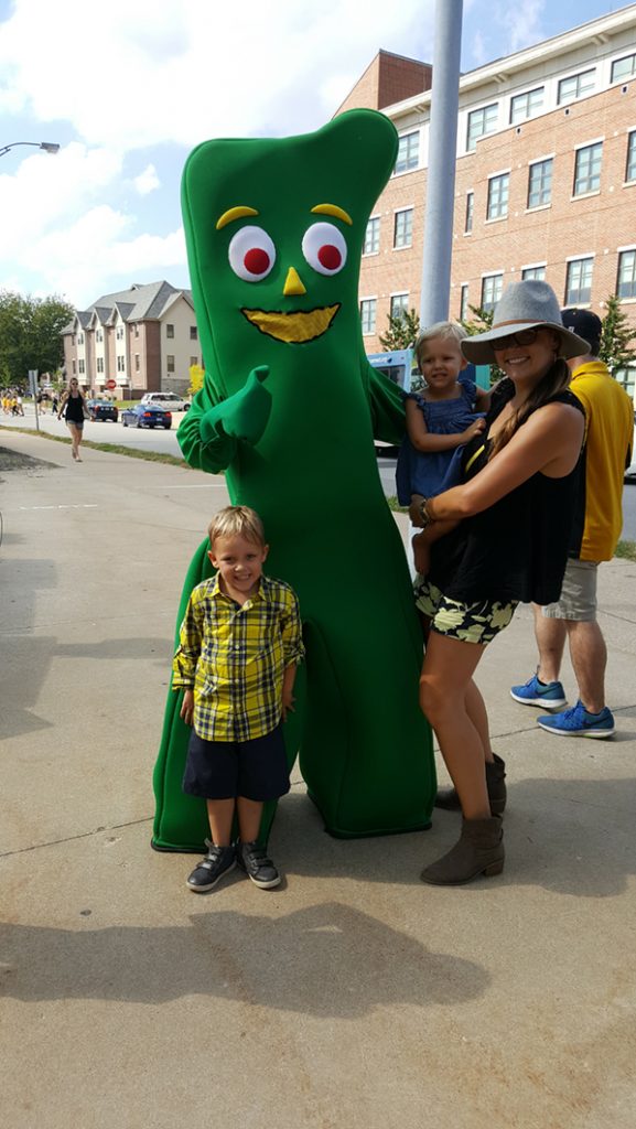 People posing with Gumby.