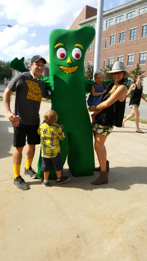People posing with Gumby.
