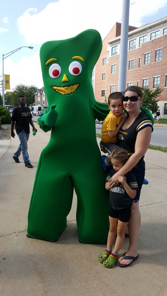 People posing with Gumby.