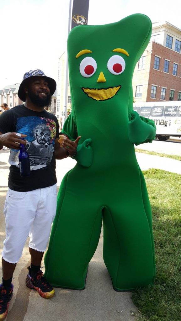 People posing with Gumby.