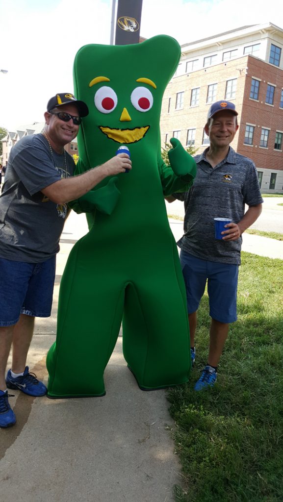 People posing with Gumby.