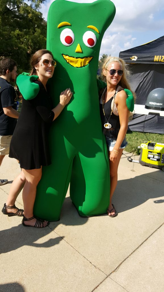 People posing with Gumby.