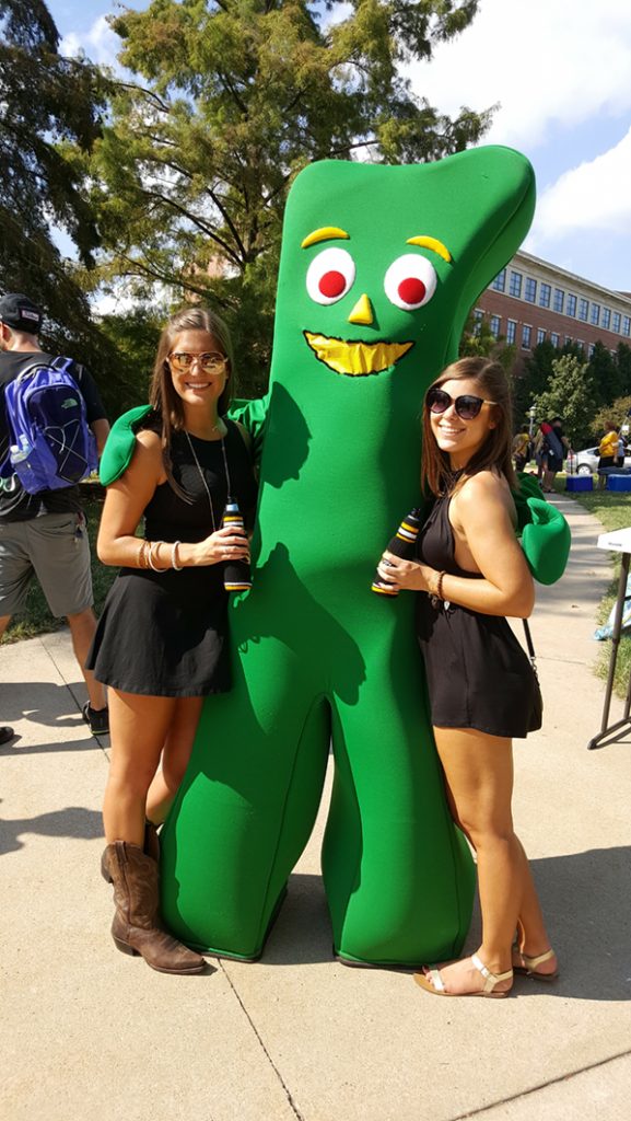 People posing with Gumby.