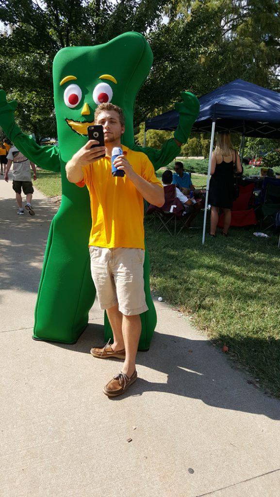 People posing with Gumby.