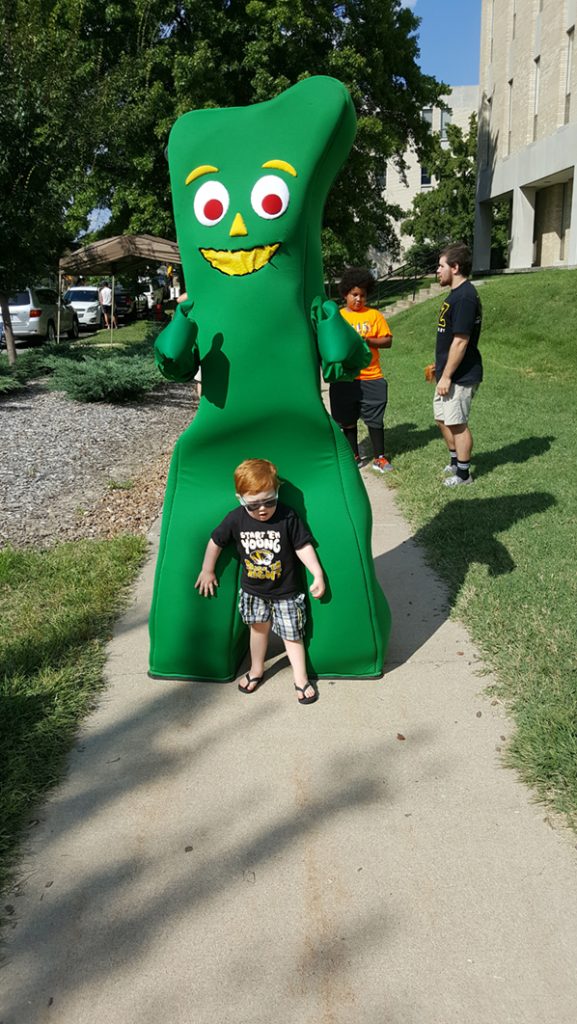 People posing with Gumby.