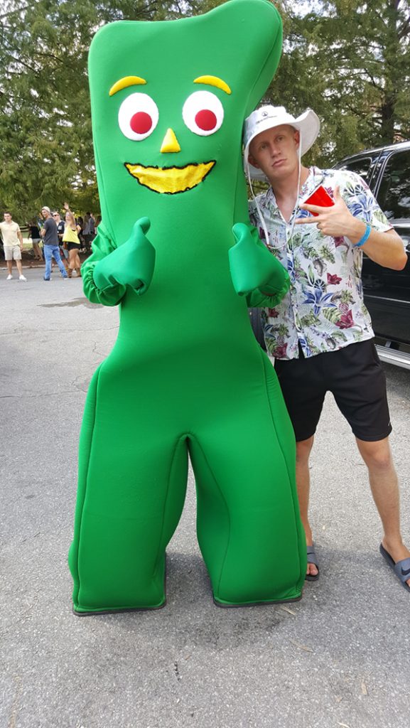 People posing with Gumby.