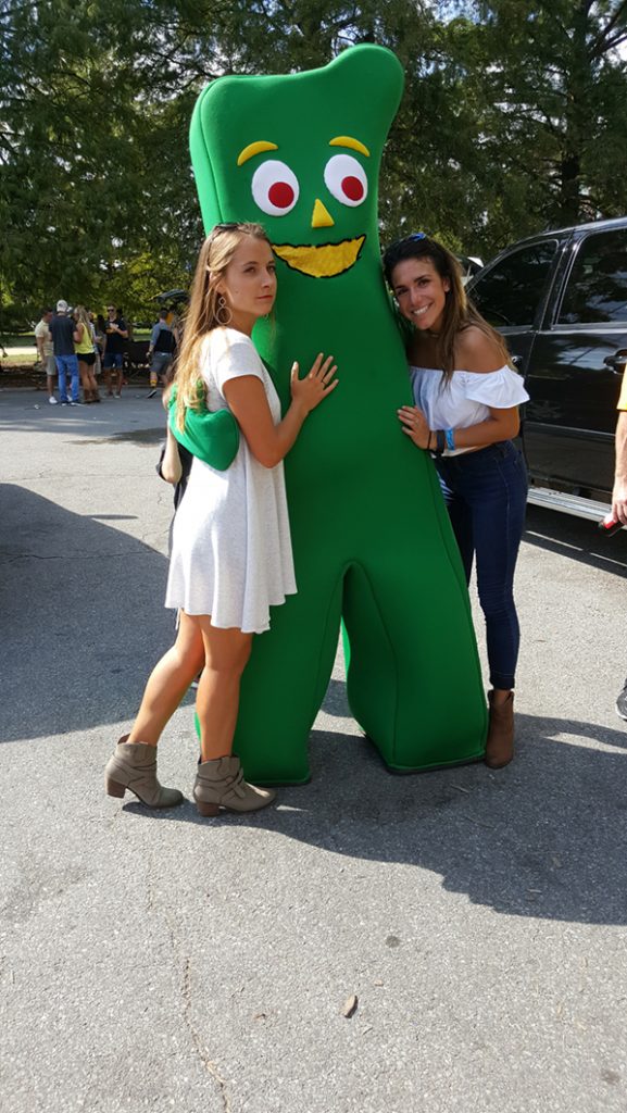 People posing with Gumby.