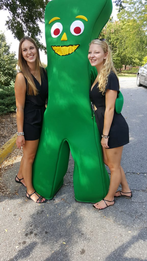 People posing with Gumby.