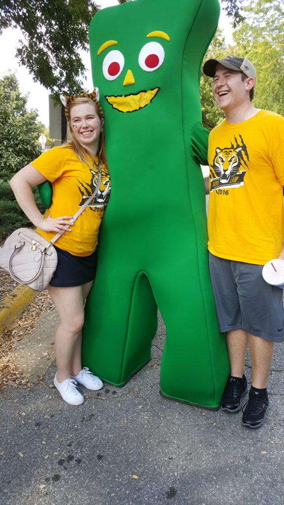 People posing with Gumby.