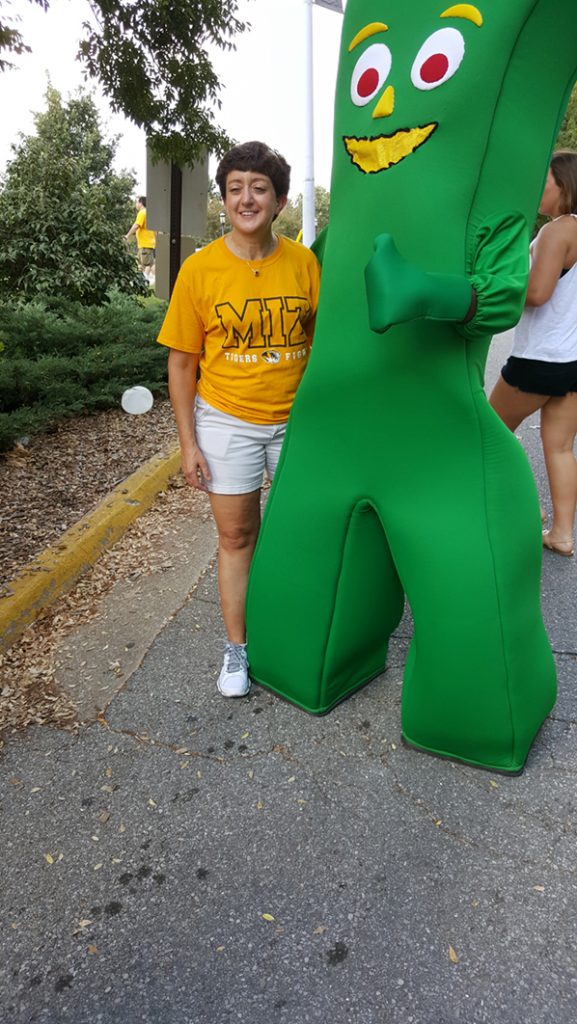 People posing with Gumby.