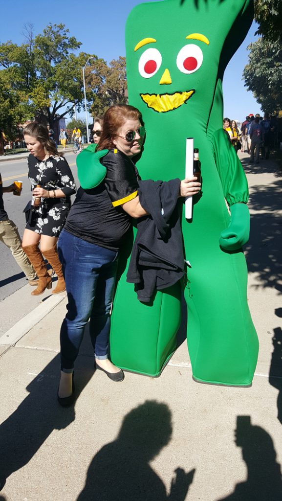 People posing with Gumby.