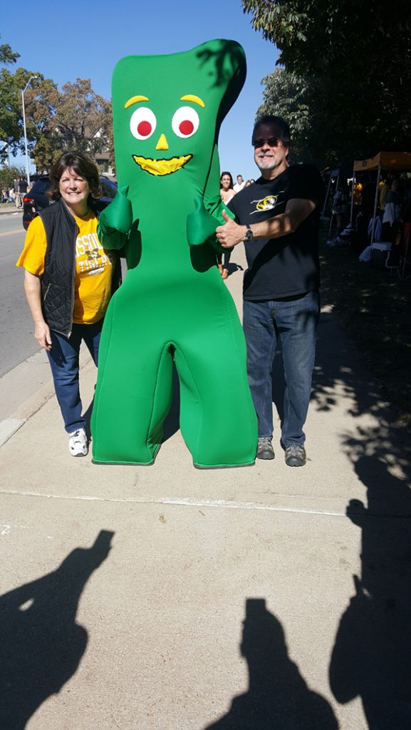 People posing with Gumby.