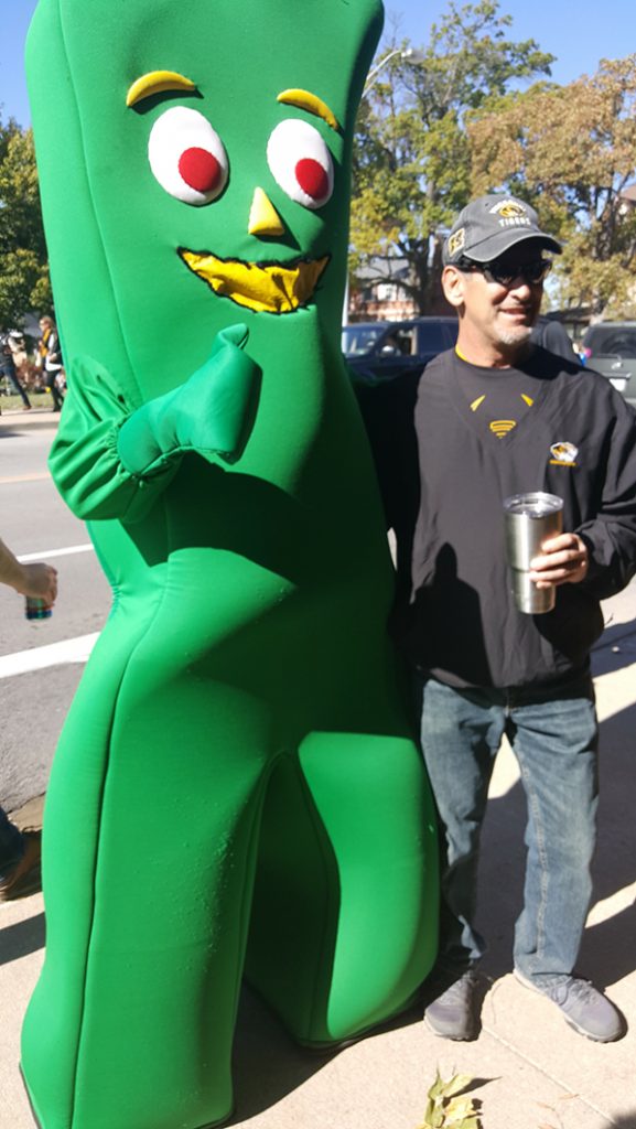 People posing with Gumby.