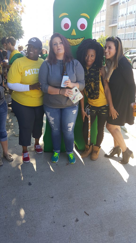 People posing with Gumby.