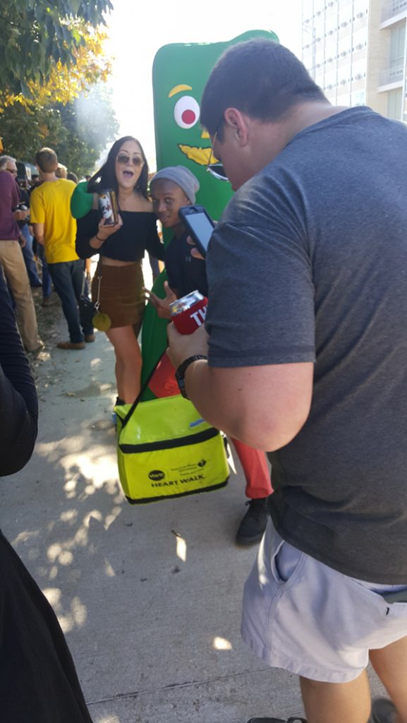 People posing with Gumby.
