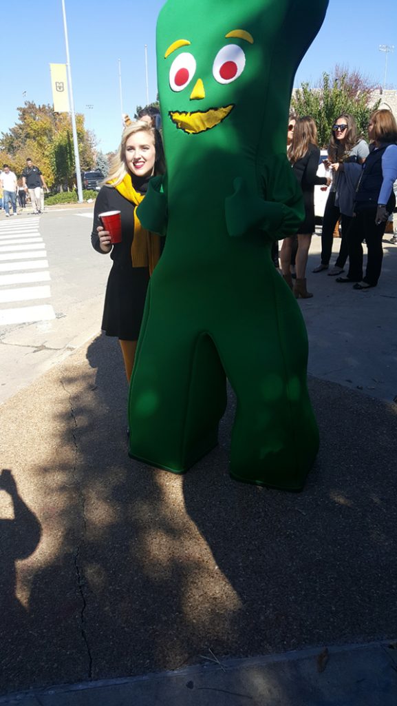 People posing with Gumby.