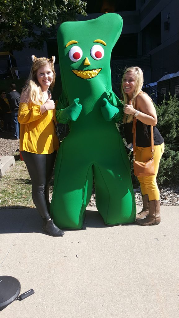 People posing with Gumby.