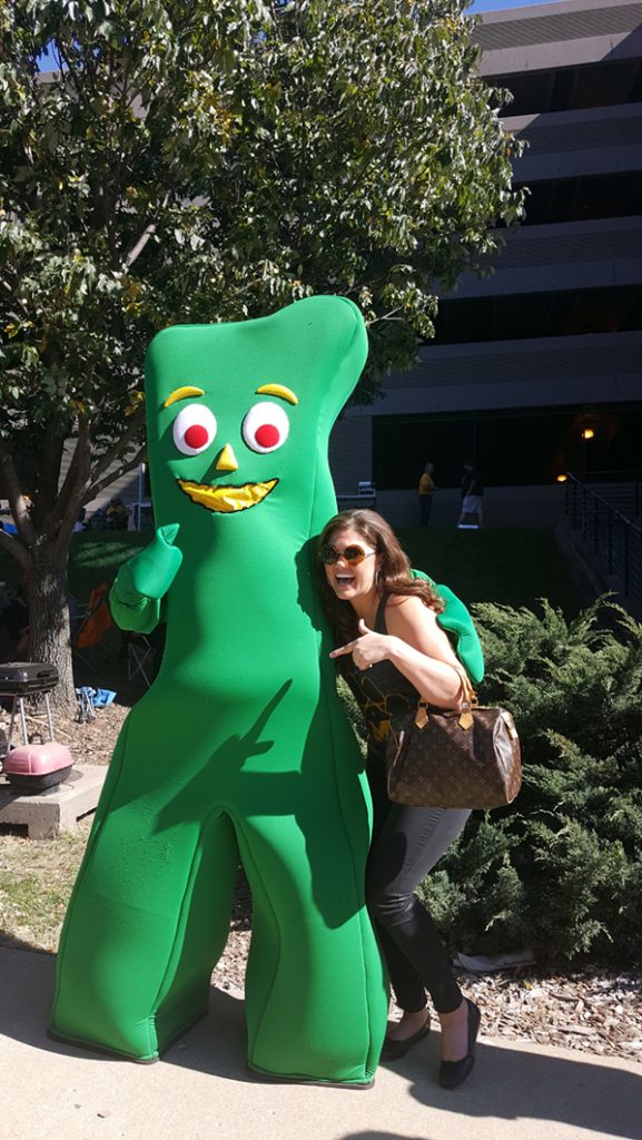 People posing with Gumby.