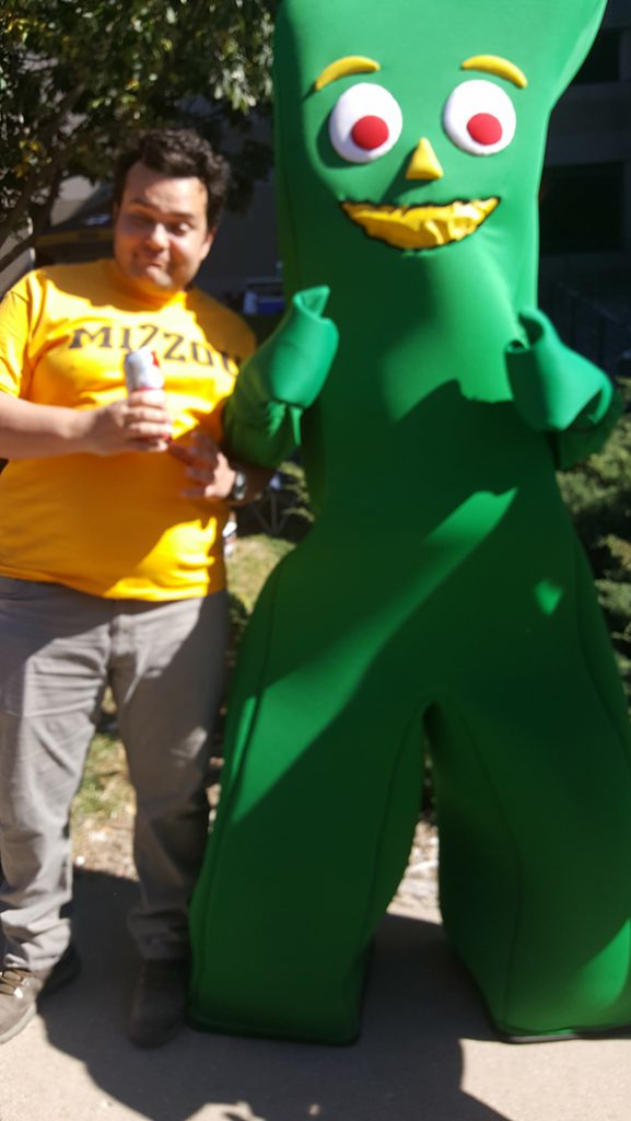 People posing with Gumby.