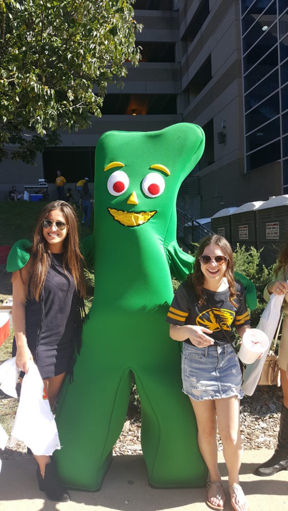 People posing with Gumby.