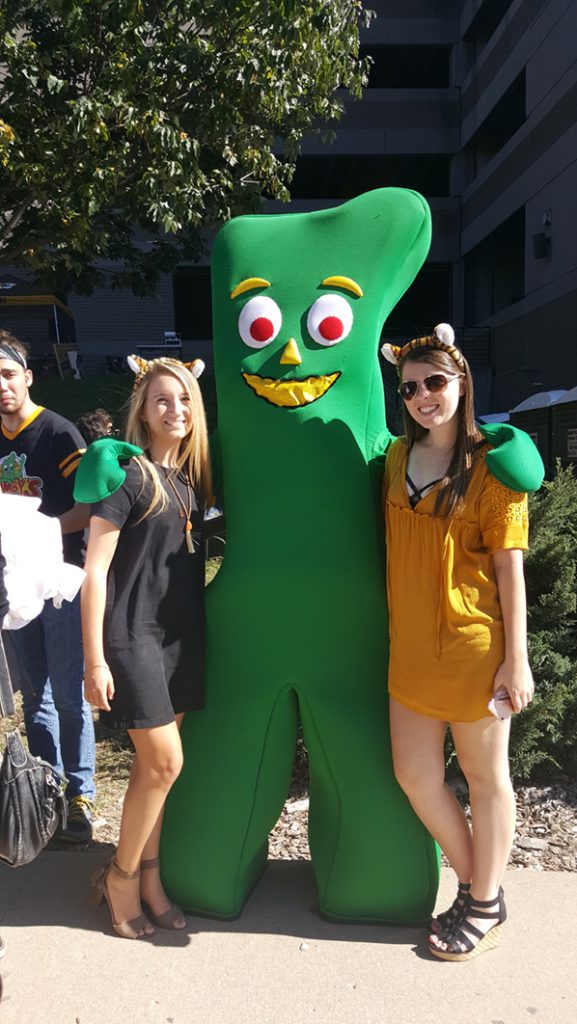 People posing with Gumby.