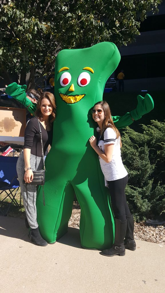 People posing with Gumby.